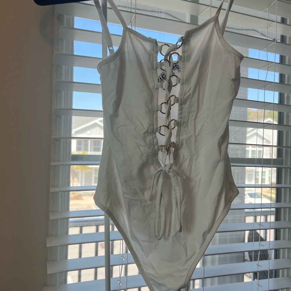 Stylish white gold bodysuit